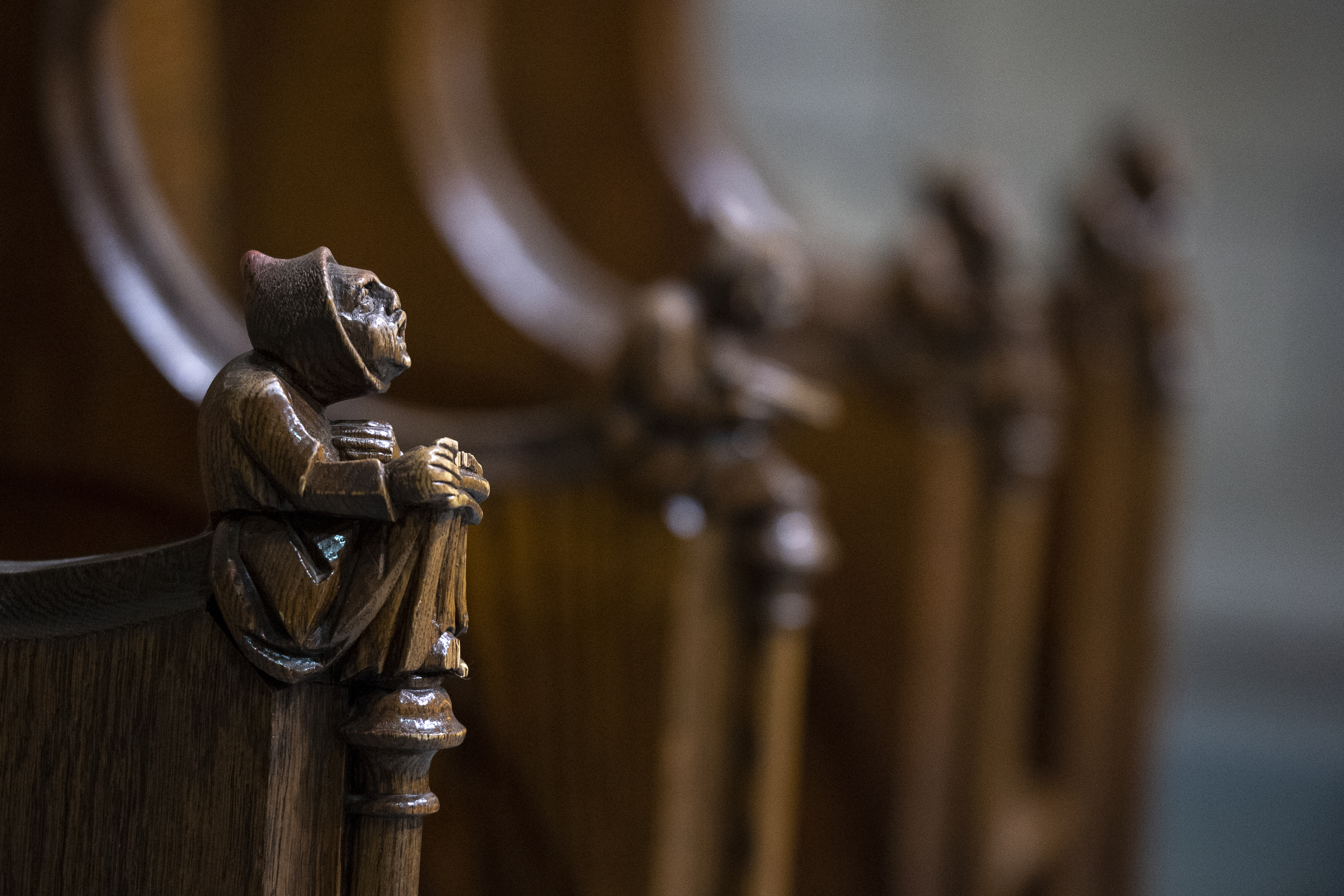 Intricate woodwork of a pew